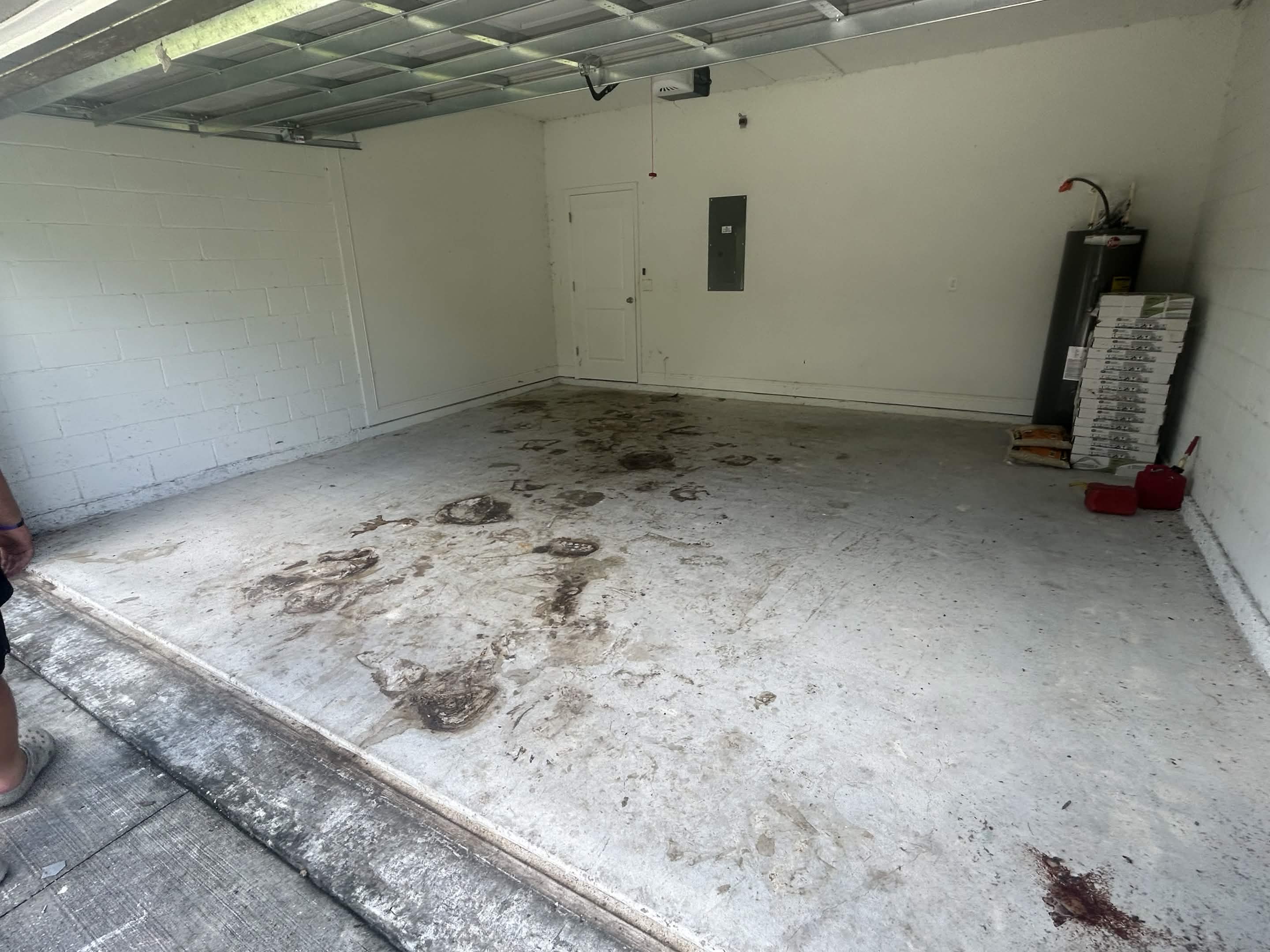 Garage after the cleanout with the floor and parking area cleared
